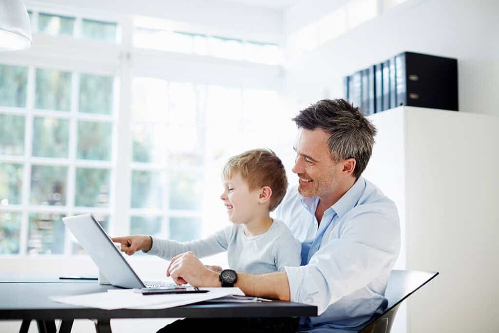 Father and son smiling representing family-focused estate planning.