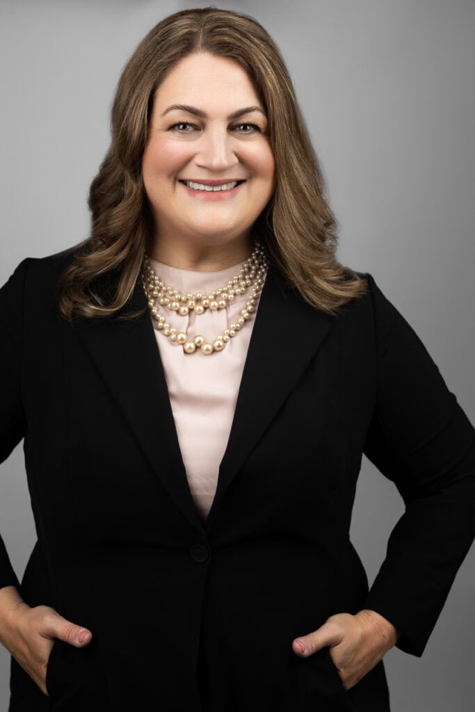 Portrait of Jennifer Wright, an attorney specializing in estate planning in a professional black suit.